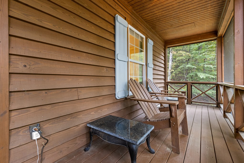 540 Old Mill Road Suches, GA 30572 - Photo 44 of 51 a view of balcony with wooden floor and outdoor seating