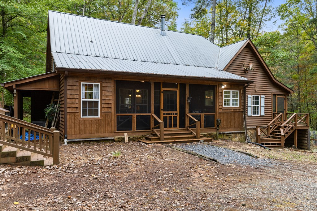540 Old Mill Road Suches, GA 30572 - Photo 45 of 51 a front view of a house with garden