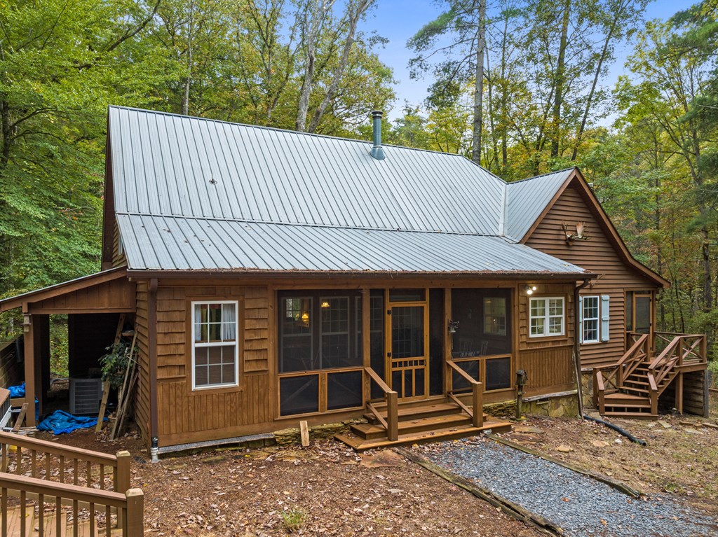 540 Old Mill Road Suches, GA 30572 - Photo 48 of 51 a view of a house with a patio and wooden fence