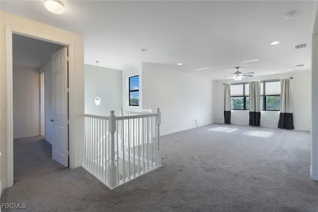 a view of a hallway with a bathroom