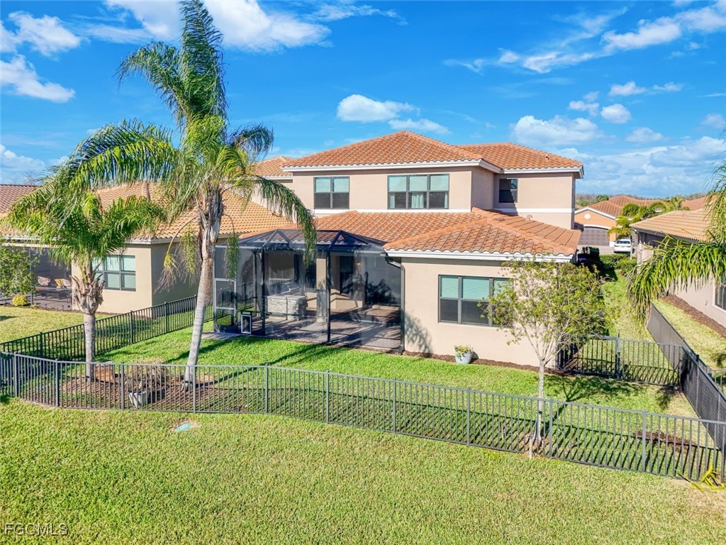 11727 Kati Falls Lane Fort Myers, FL 33913 - Photo 39 of 48 a view of a house with a yard and potted plants