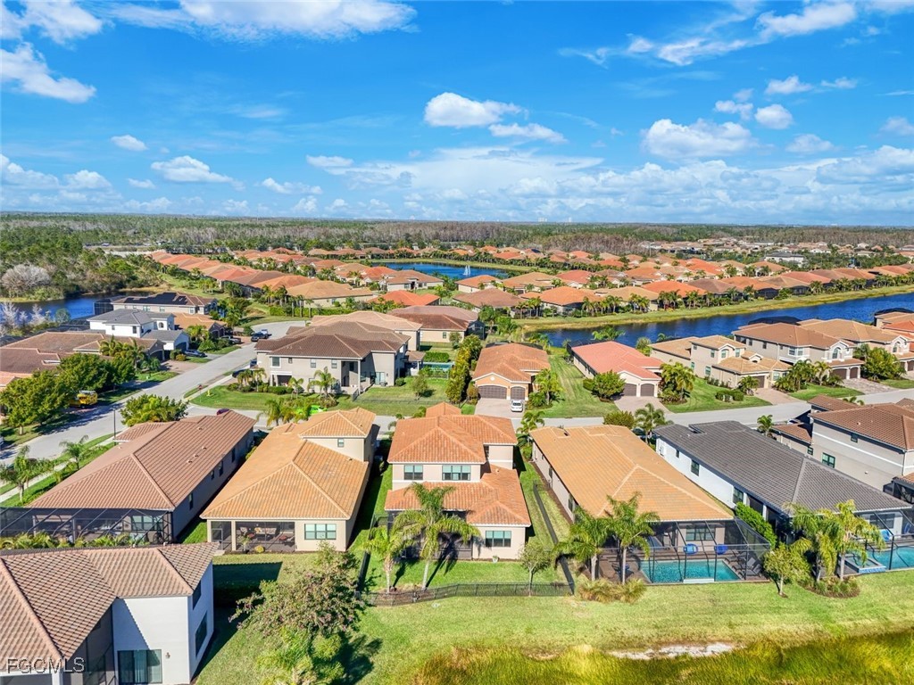 11727 Kati Falls Lane Fort Myers, FL 33913 - Photo 40 of 48 an aerial view of residential houses with outdoor space and ocean view