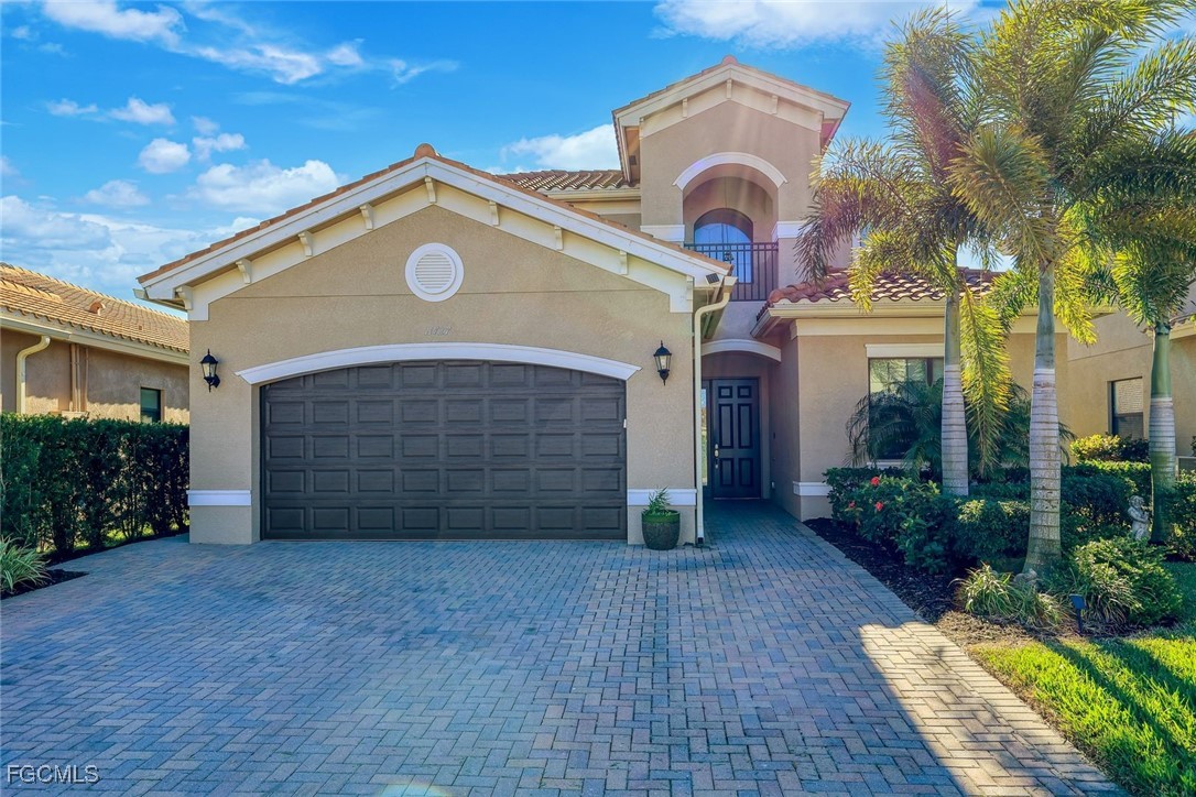 11727 Kati Falls Lane Fort Myers, FL 33913 - Photo 43 of 48 a front view of a house with a yard