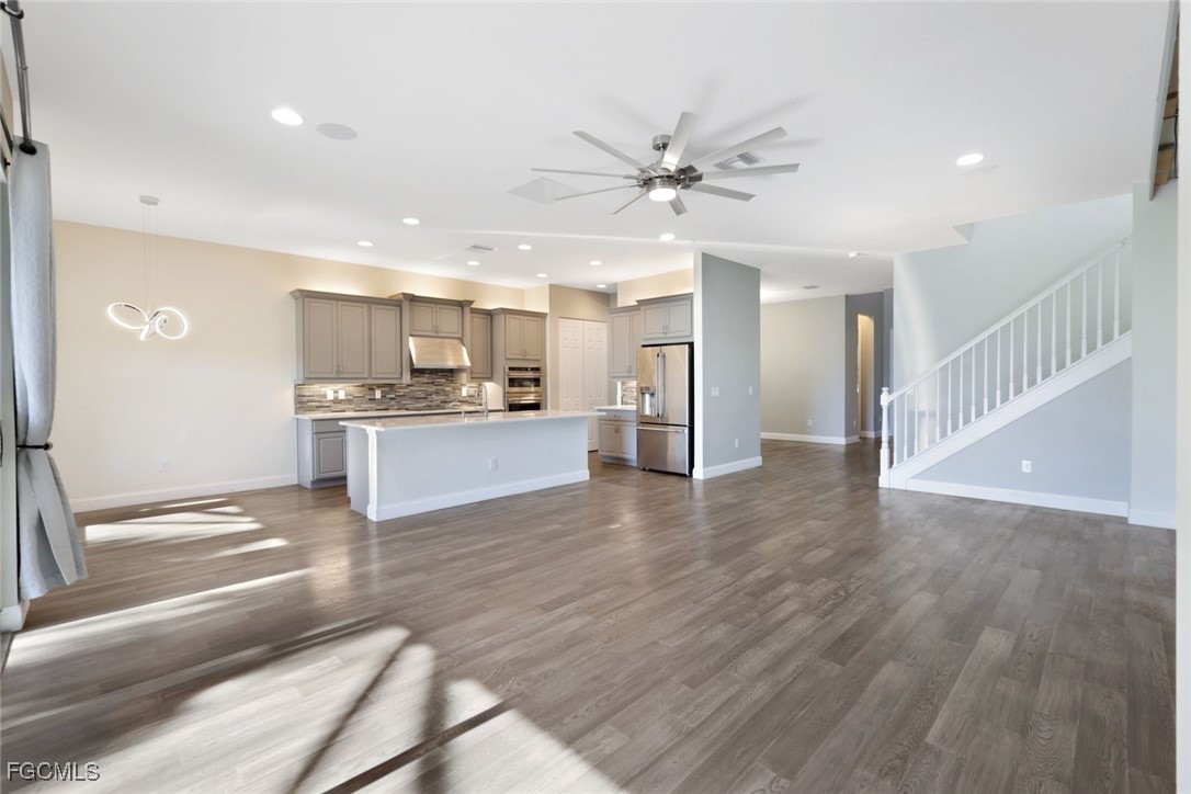 11727 Kati Falls Lane Fort Myers, FL 33913 - Photo 5 of 48 a view of a kitchen with a sink and a refrigerator