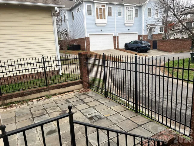 a view of a patio with a table and chairs