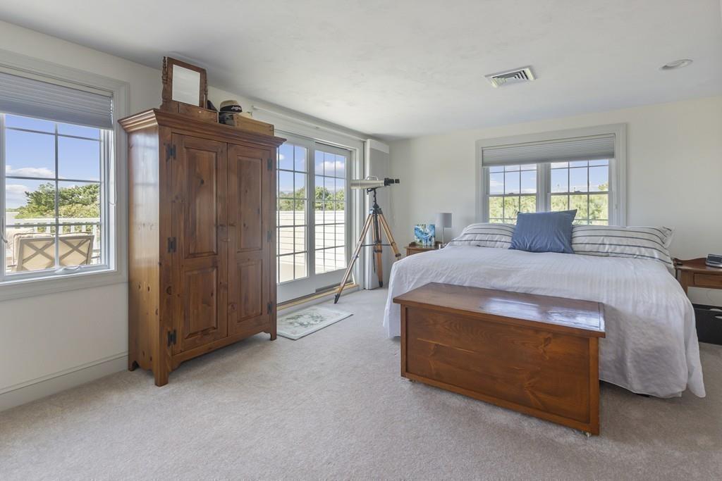 171 Great Neck Road Wareham, MA 02571 - Photo 15 of 26 a spacious bedroom with a bed and a window
