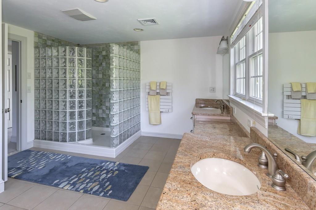 171 Great Neck Road Wareham, MA 02571 - Photo 17 of 26 a bathroom with a granite countertop sink a mirror and shower