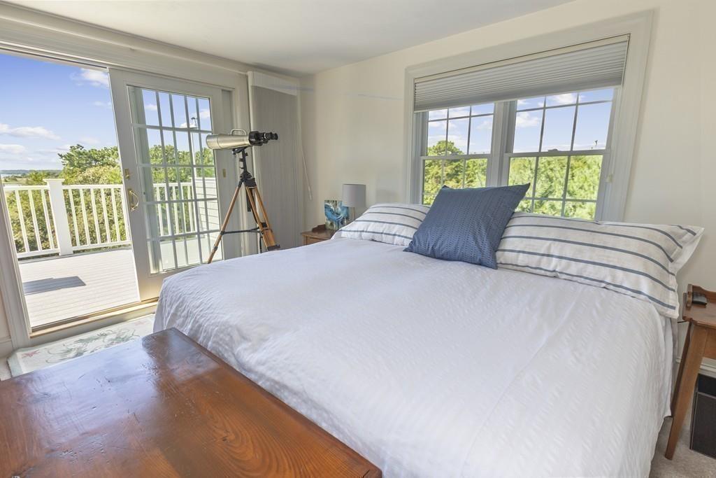171 Great Neck Road Wareham, MA 02571 - Photo 18 of 26 a large bed sitting in a bedroom next to a window