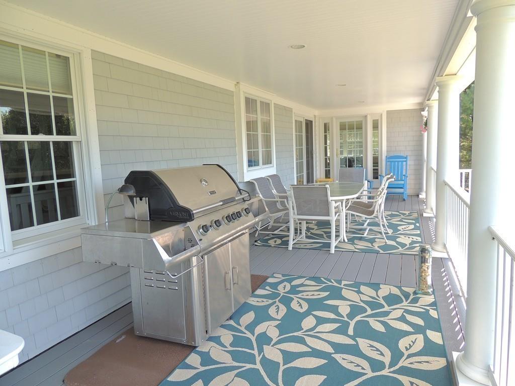 171 Great Neck Road Wareham, MA 02571 - Photo 24 of 26 a living room with furniture and a flat screen tv