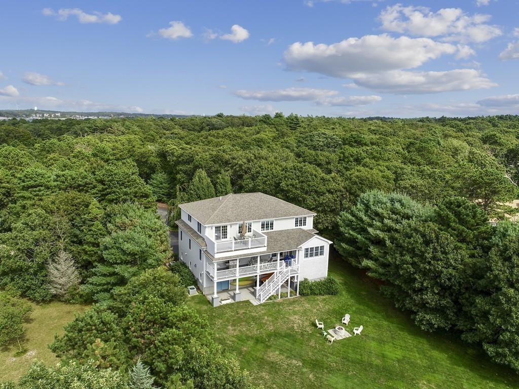 171 Great Neck Road Wareham, MA 02571 - Photo 26 of 26 a view of a big room with a big yard and large trees