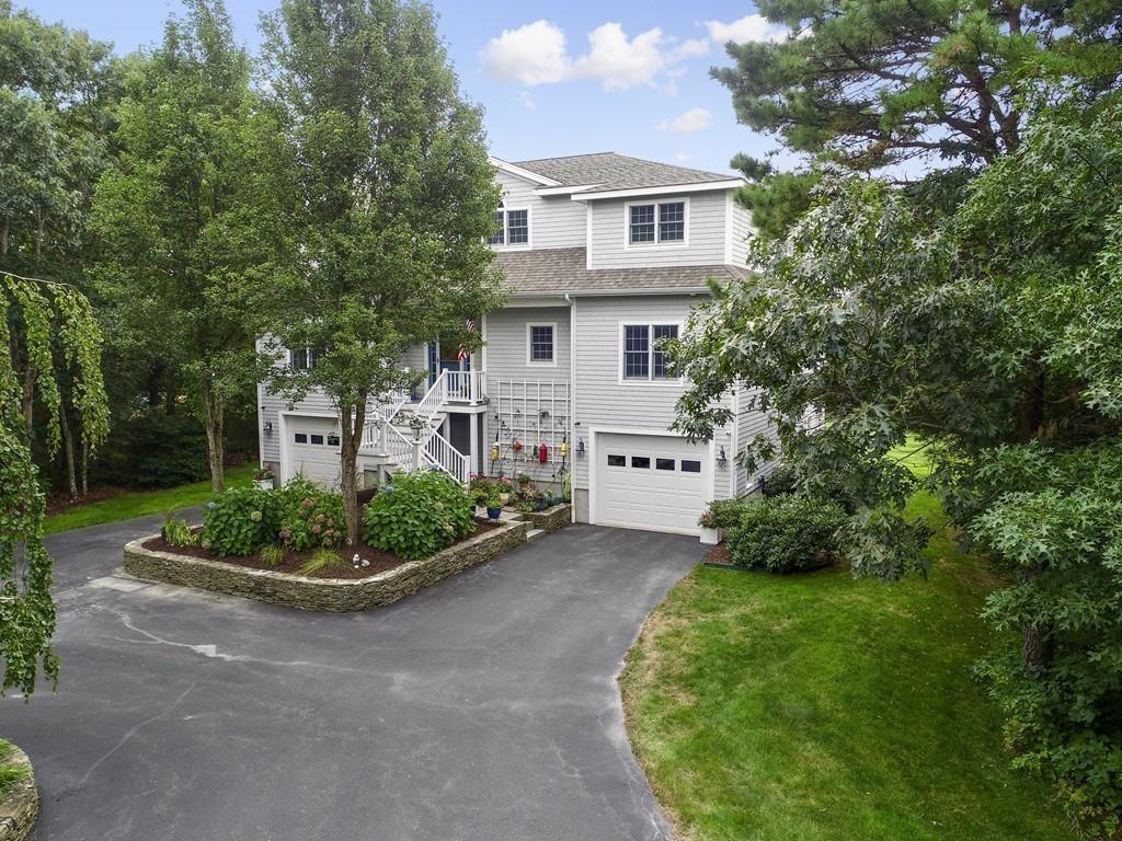 171 Great Neck Road Wareham, MA 02571 - Photo 3 of 26 a front view of a house with a garden