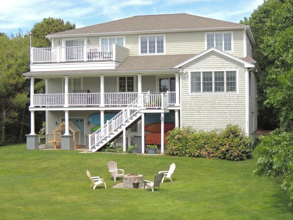 171 Great Neck Road Wareham, MA 02571 - Photo 4 of 26 a front view of a house with a yard table and chairs