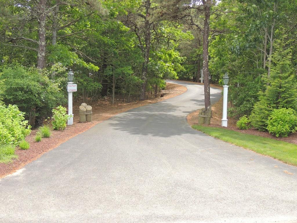 171 Great Neck Road Wareham, MA 02571 - Photo 5 of 26 a view of a road with trees and plants