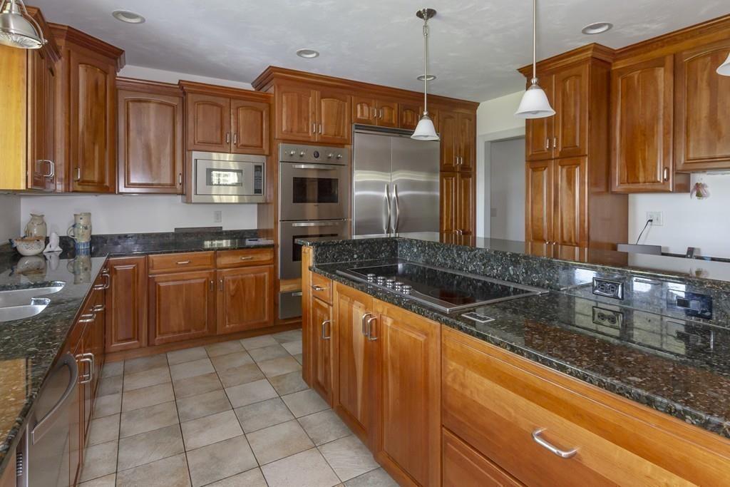 171 Great Neck Road Wareham, MA 02571 - Photo 8 of 26 a kitchen with stainless steel appliances granite countertop a sink stove and refrigerator