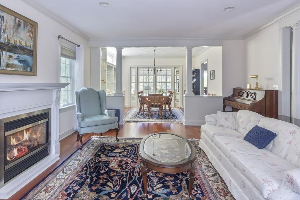 171 Great Neck Road Wareham, MA 02571 - Photo 10 of 26 a living room with furniture a fireplace and a large window