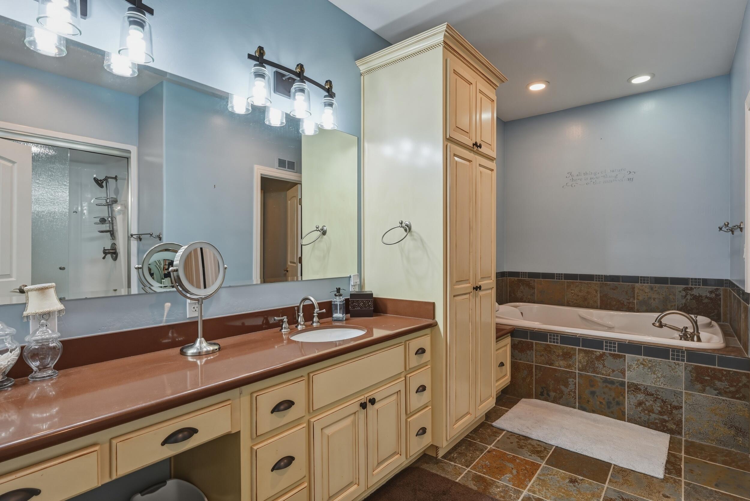 1233 Merzville Road Forest Lakes, AZ 85931 - Photo 19 of 39 a spacious bathroom with a sink double vanity granite tub and shower