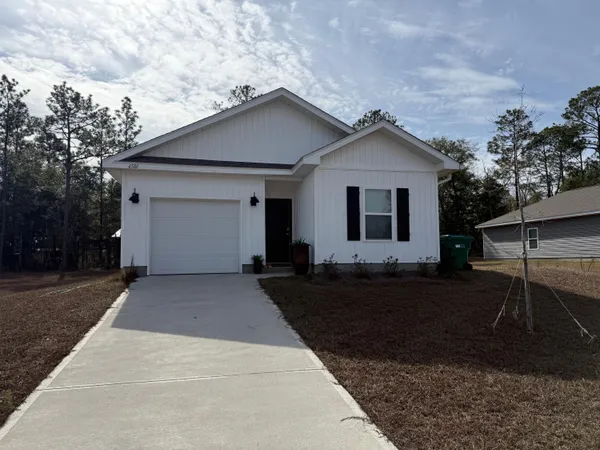 a front view of a house with yard