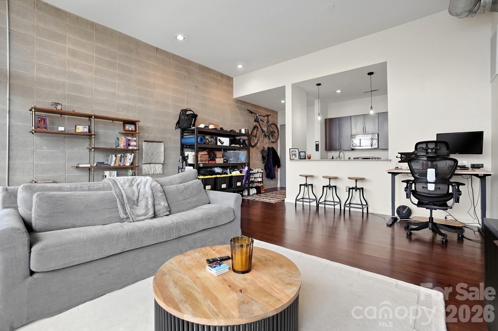 2116 McClintock Road, Unit 221 Charlotte, NC 28205 - Photo 12 of 44 a living room with furniture and a wooden floor