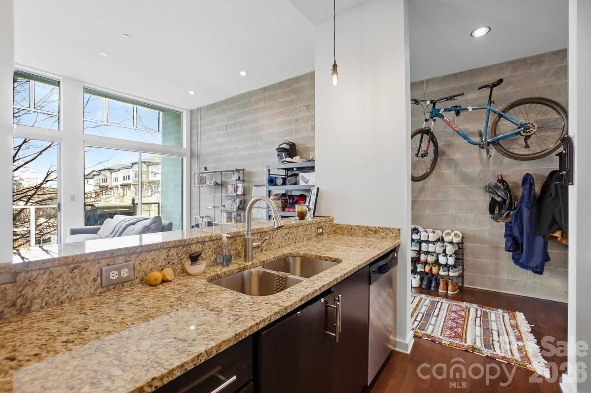 2116 McClintock Road, Unit 221 Charlotte, NC 28205 - Photo 18 of 44 a kitchen with a sink and a refrigerator