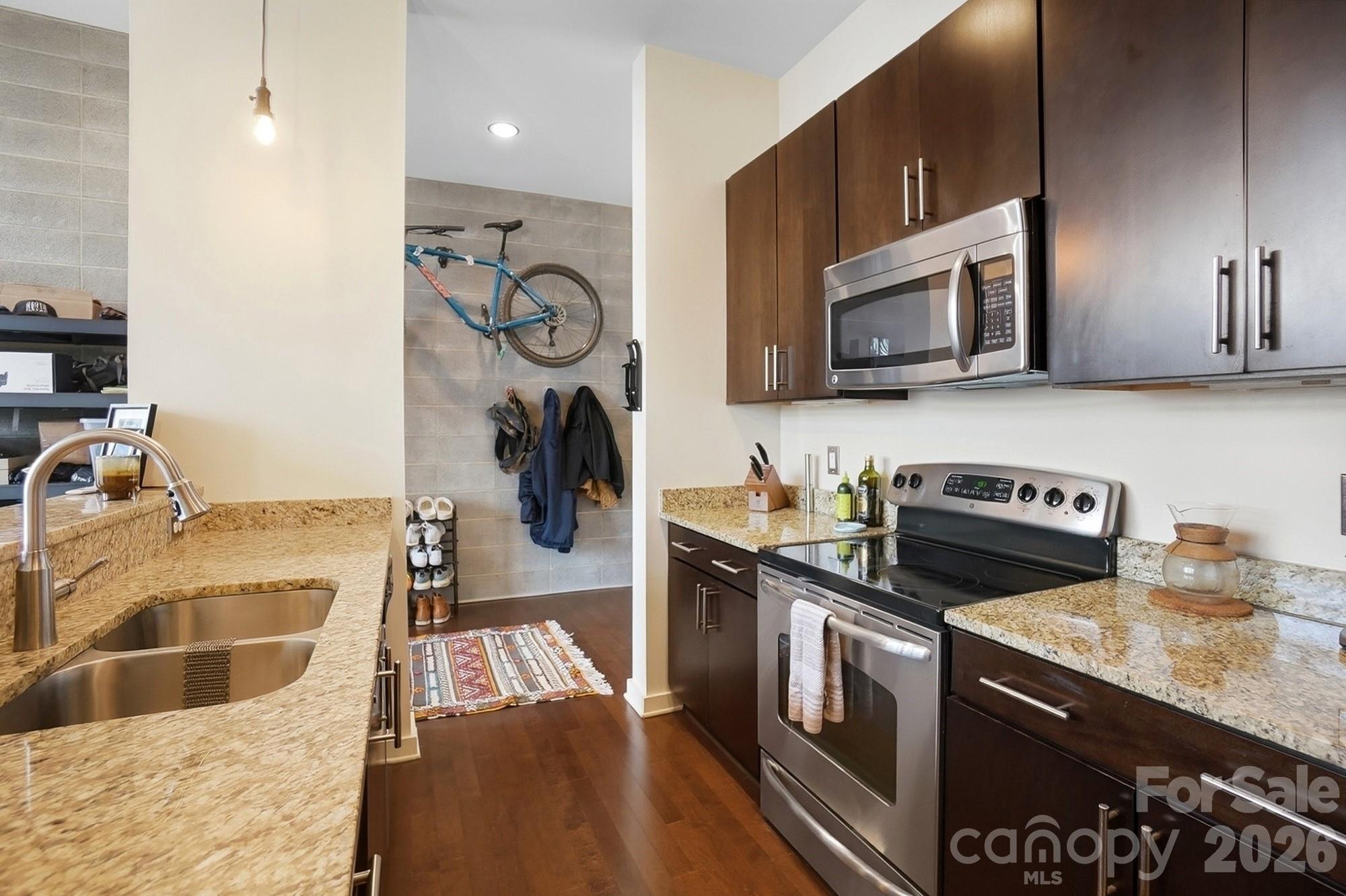 2116 McClintock Road, Unit 221 Charlotte, NC 28205 - Photo 19 of 44 a kitchen with a stove and a sink