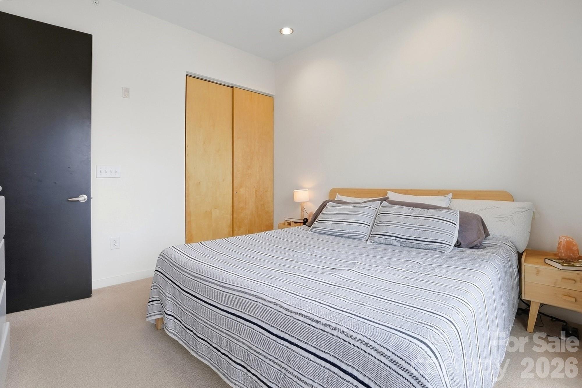 2116 McClintock Road, Unit 221 Charlotte, NC 28205 - Photo 22 of 44 a bedroom with a bed and a window