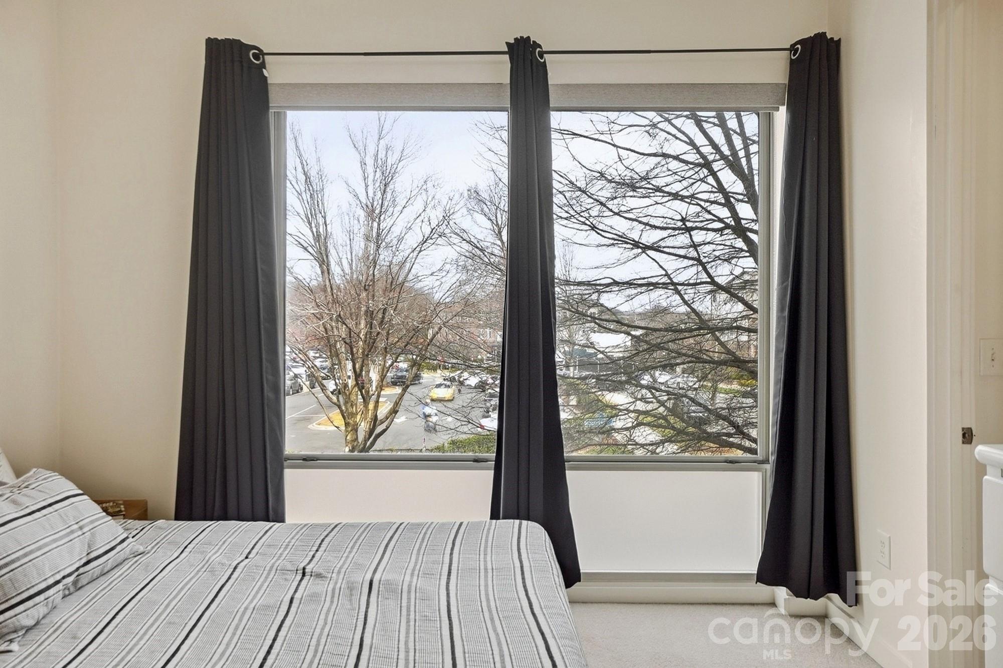 2116 McClintock Road, Unit 221 Charlotte, NC 28205 - Photo 23 of 44 a view of a room that has a large window