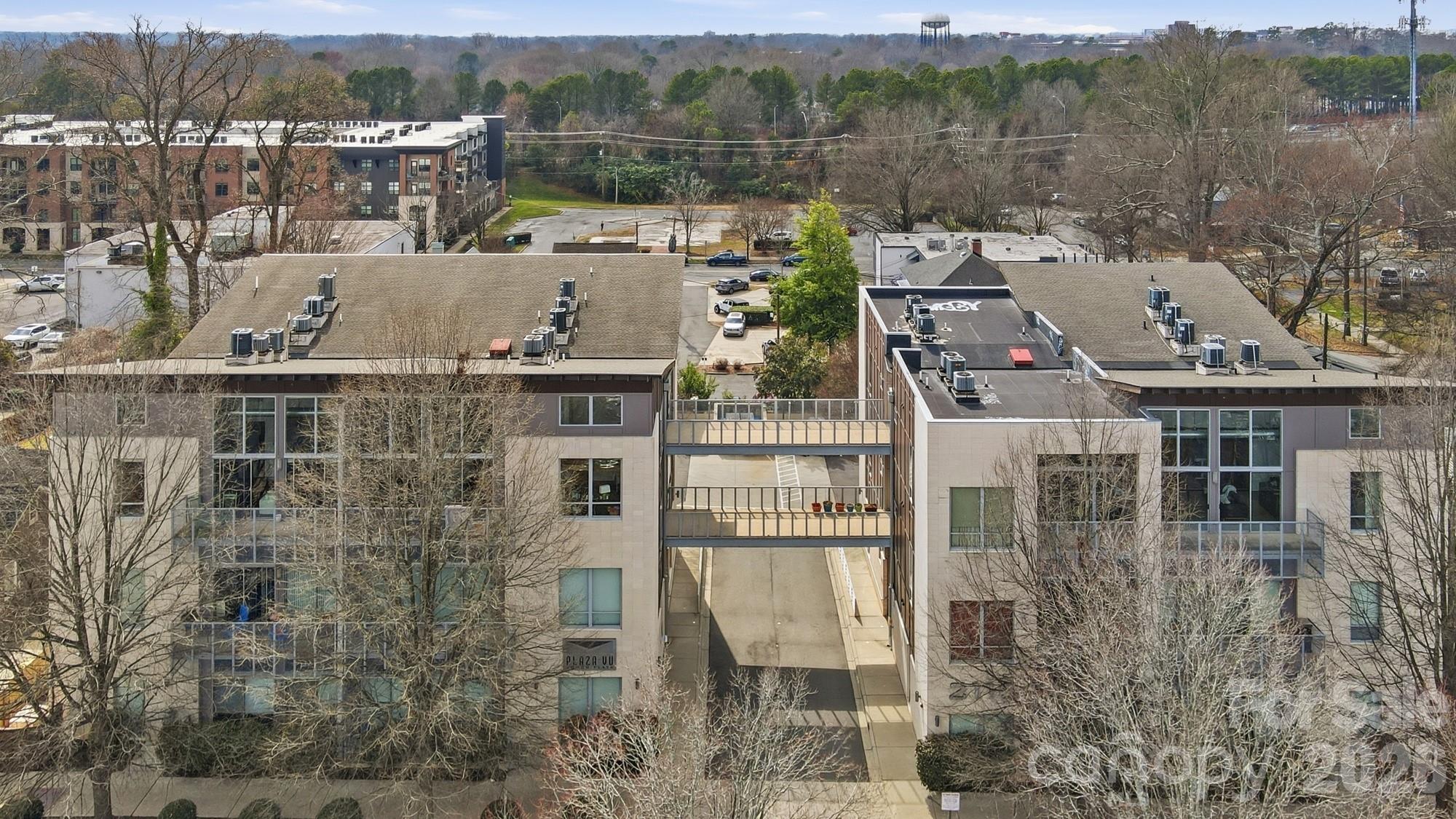 2116 McClintock Road, Unit 221 Charlotte, NC 28205 - Photo 39 of 44 a view of a city with tall buildings