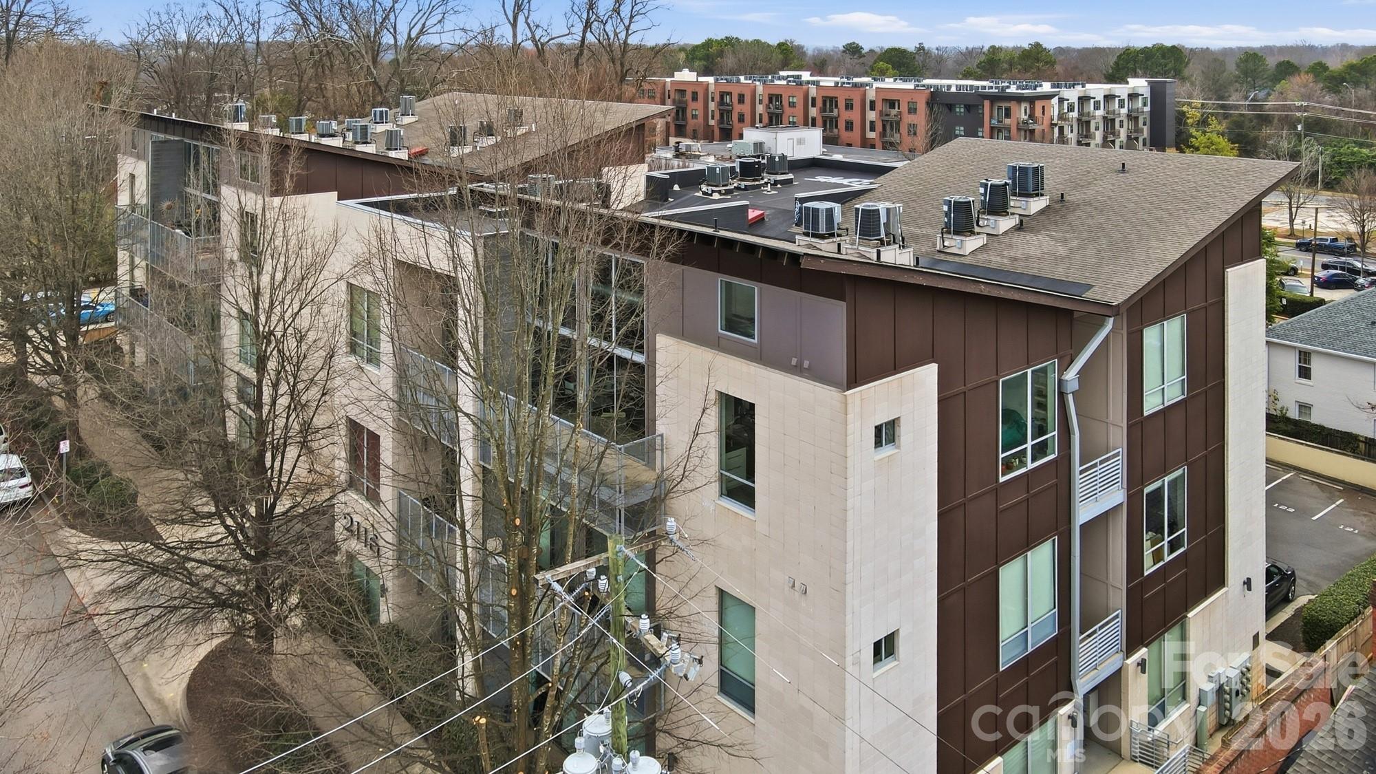 2116 McClintock Road, Unit 221 Charlotte, NC 28205 - Photo 40 of 44 a terrace of a house with barbeque oven and outdoor seating