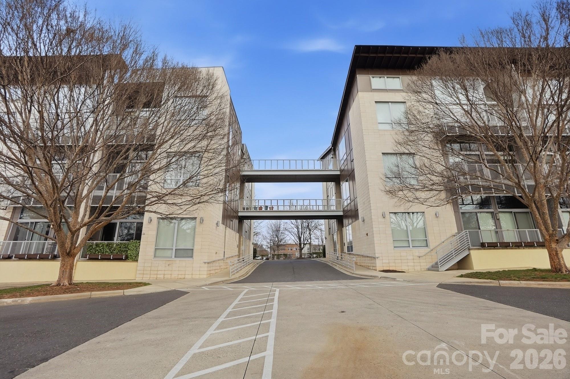 2116 McClintock Road, Unit 221 Charlotte, NC 28205 - Photo 4 of 44 a view of a brick house with a large windows