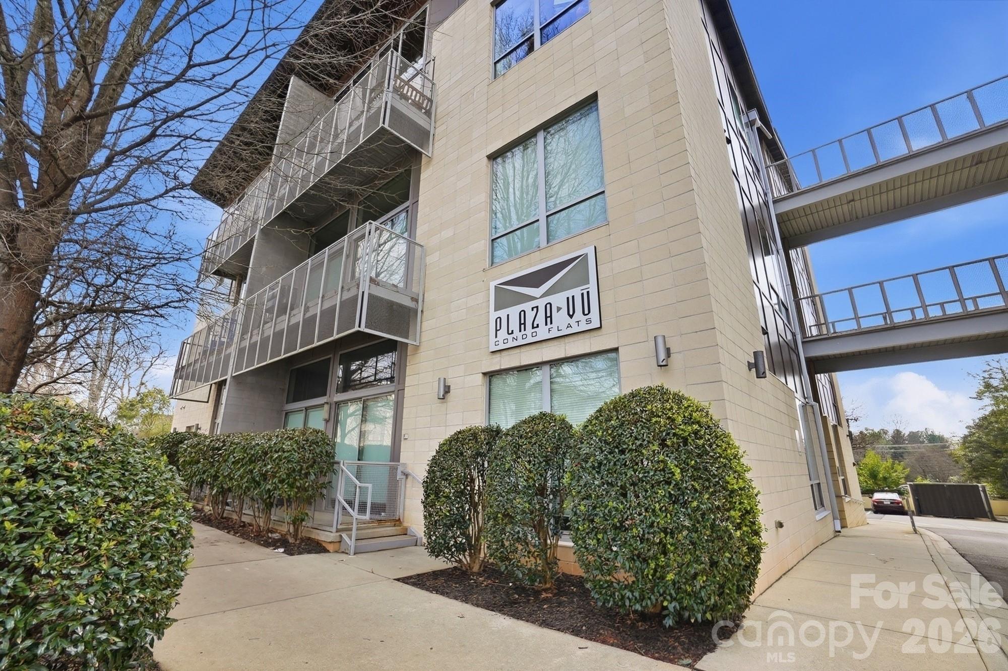 2116 McClintock Road, Unit 221 Charlotte, NC 28205 - Photo 41 of 44 a view of a street with potted plants