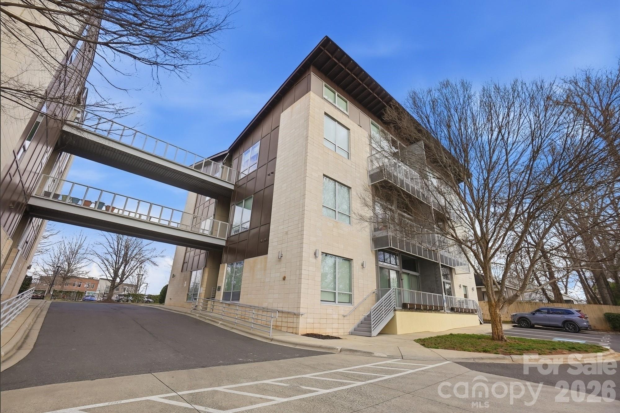 2116 McClintock Road, Unit 221 Charlotte, NC 28205 - Photo 42 of 44 a view of a building with a street