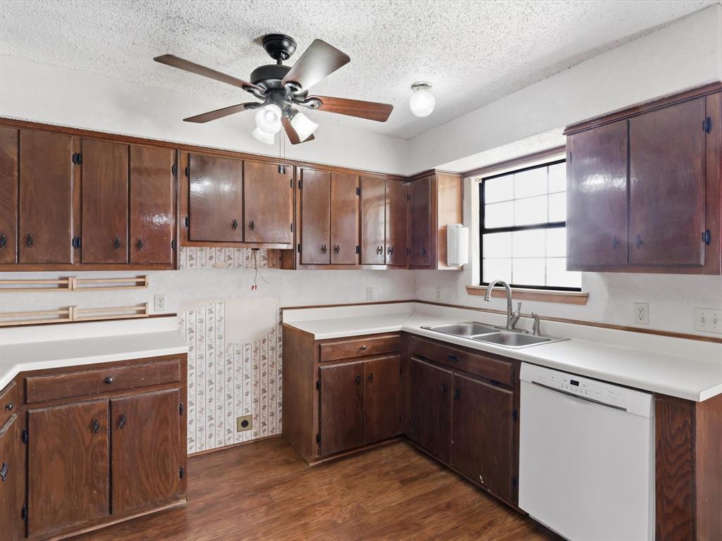 701 College Street Celeste, TX 75423 - Photo 12 of 29 a kitchen with a sink cabinets and window