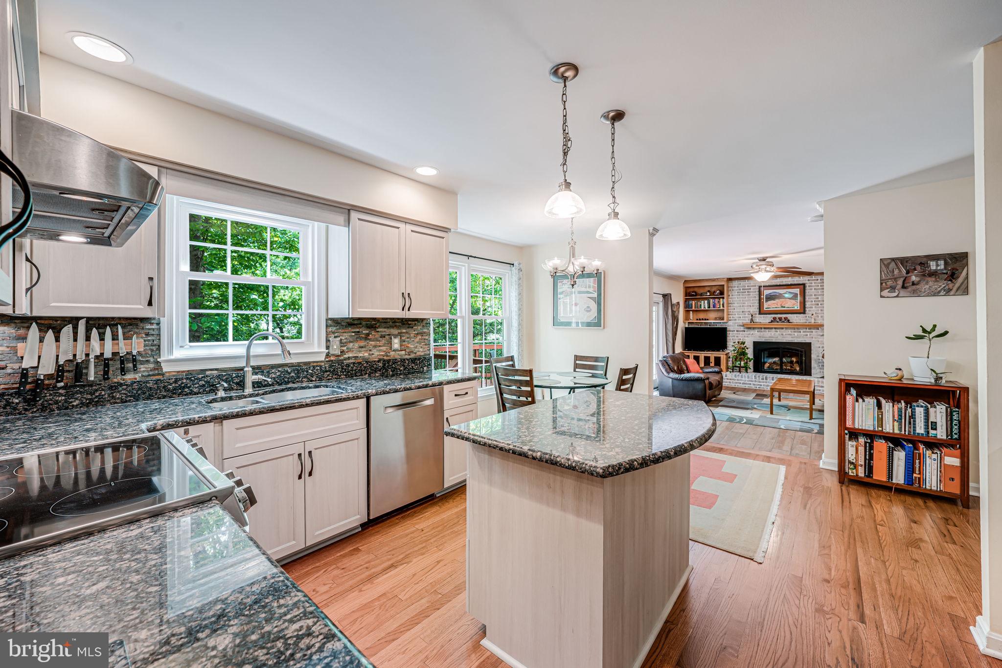 9802 Natick Road Burke, VA 22015 - Photo 11 of 45 a kitchen with sink and center island