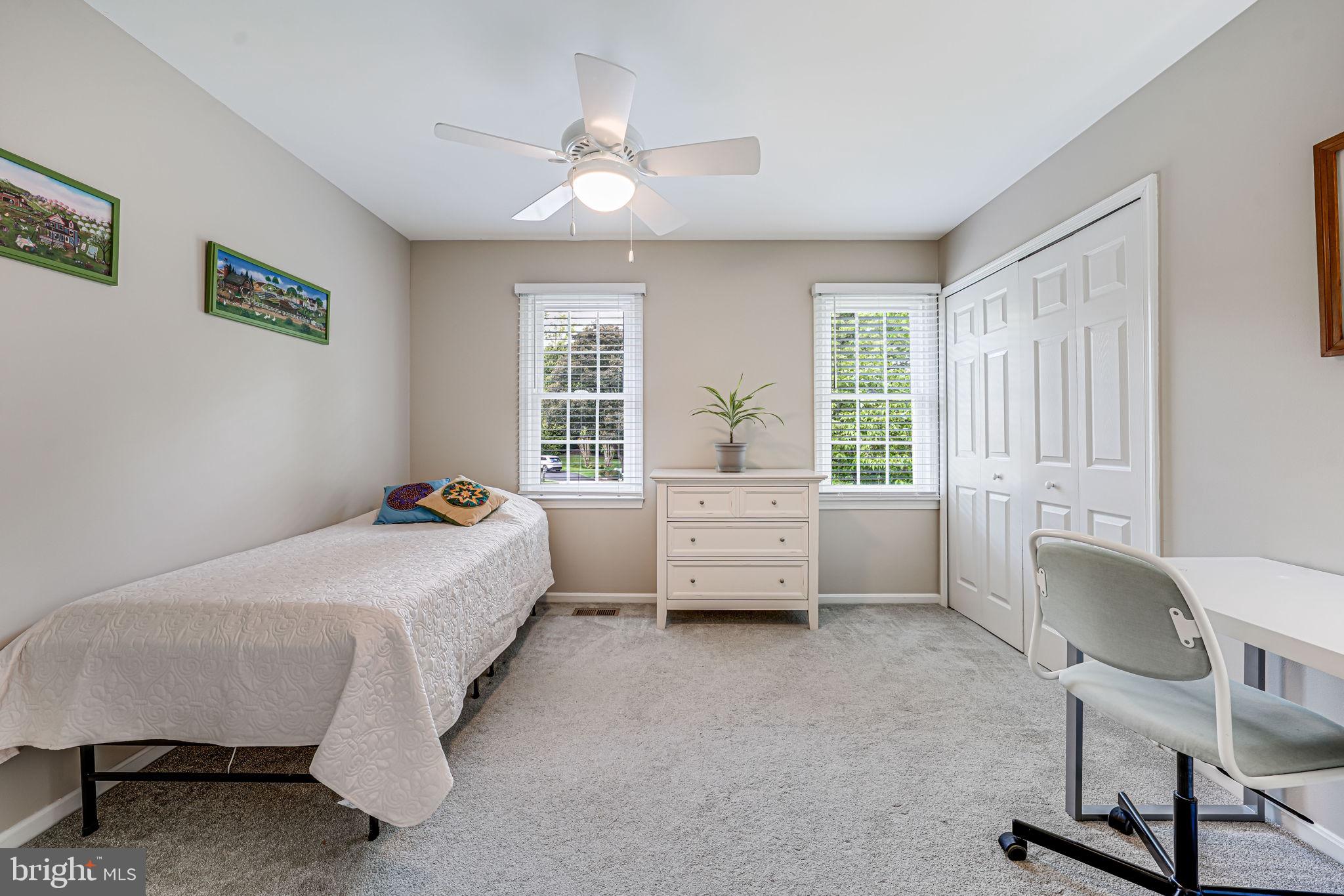 9802 Natick Road Burke, VA 22015 - Photo 19 of 45 a bedroom with a bed chair and a window