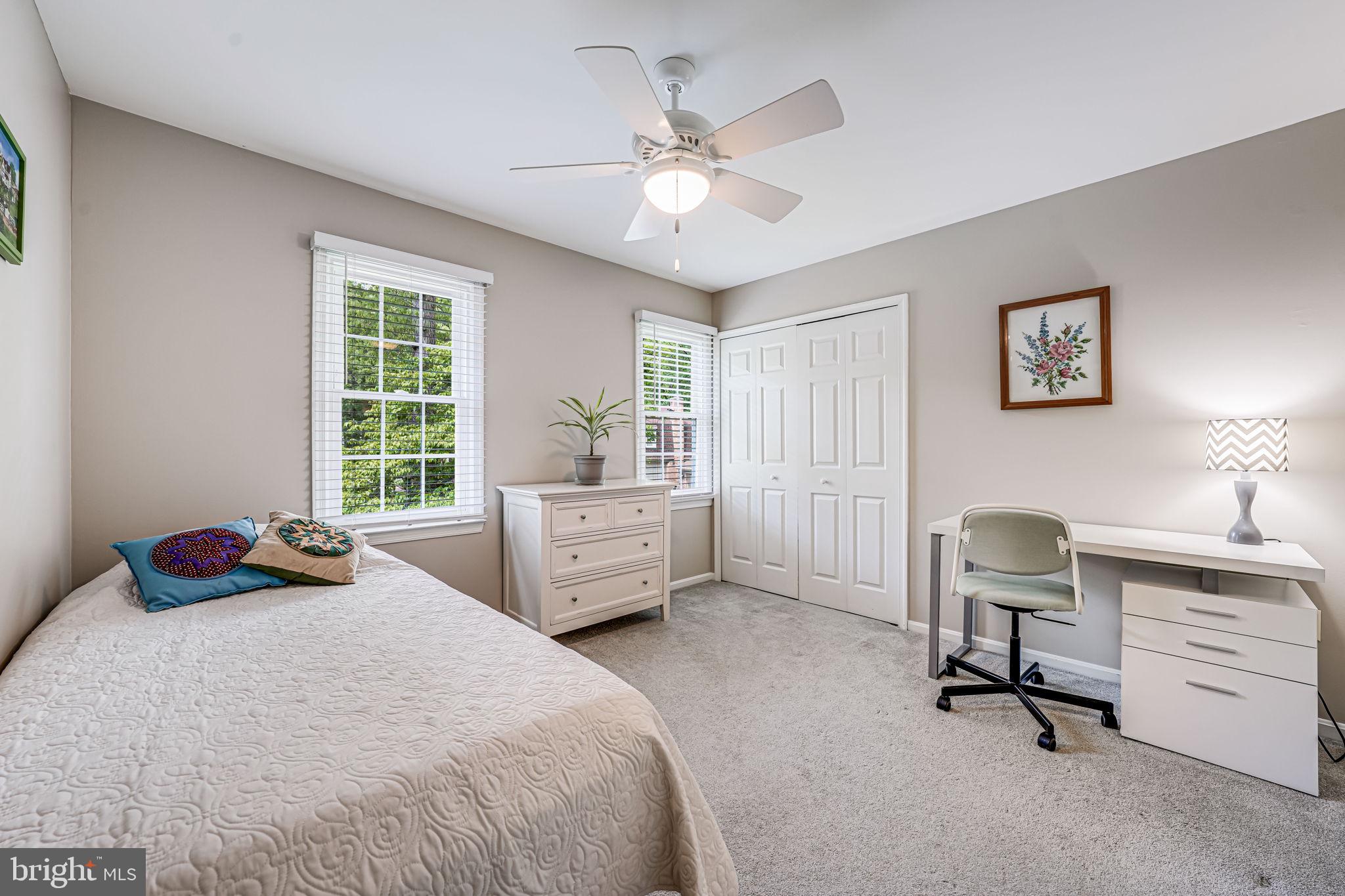 9802 Natick Road Burke, VA 22015 - Photo 20 of 45 a bedroom with a bed and a chair