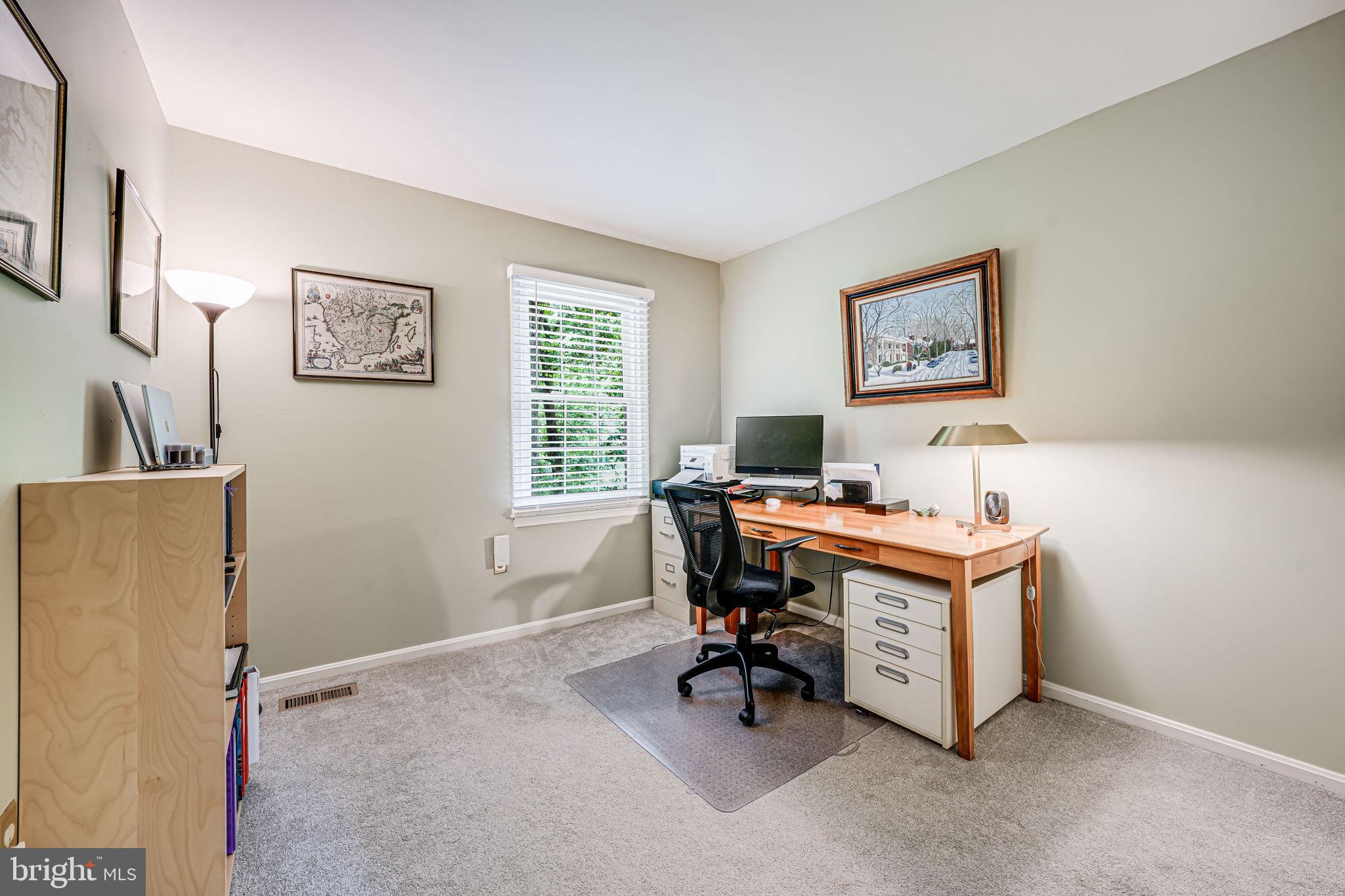 9802 Natick Road Burke, VA 22015 - Photo 22 of 45 a view of a workspace with furniture and a window