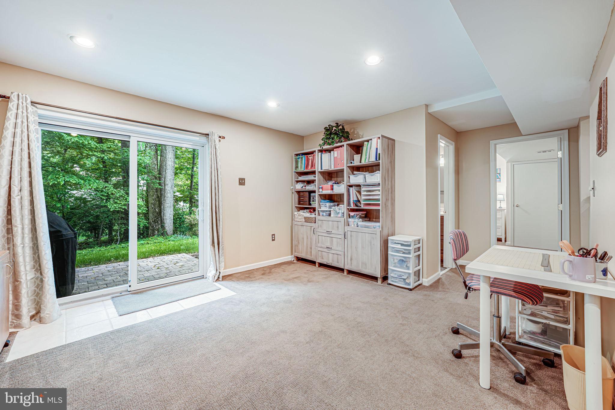 9802 Natick Road Burke, VA 22015 - Photo 33 of 45 a view of an empty room with windows & cabinet