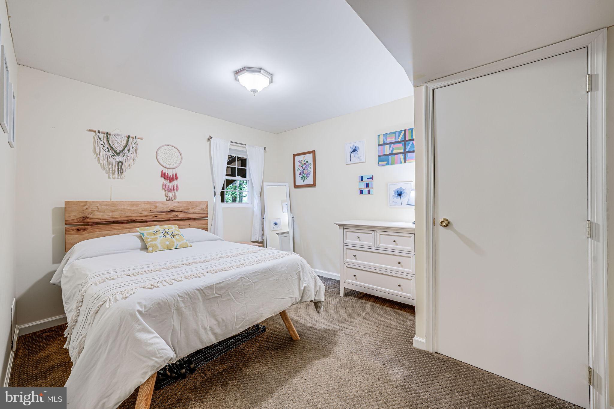 9802 Natick Road Burke, VA 22015 - Photo 35 of 45 a bedroom with a bed and a window