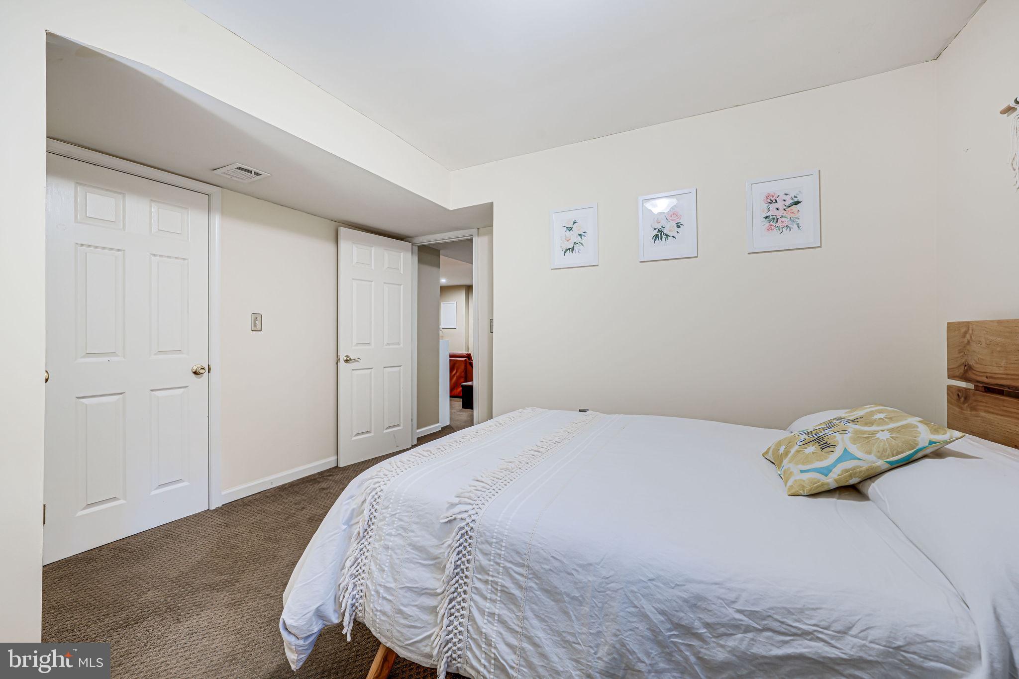 9802 Natick Road Burke, VA 22015 - Photo 36 of 45 a bedroom with a bed and a window