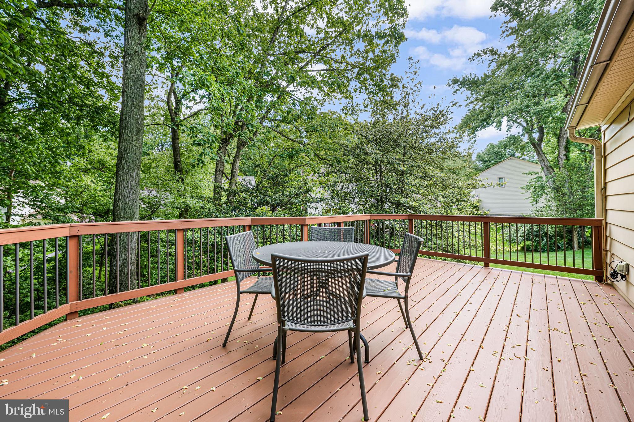 9802 Natick Road Burke, VA 22015 - Photo 38 of 45 a view of a deck with two chair and wooden floor