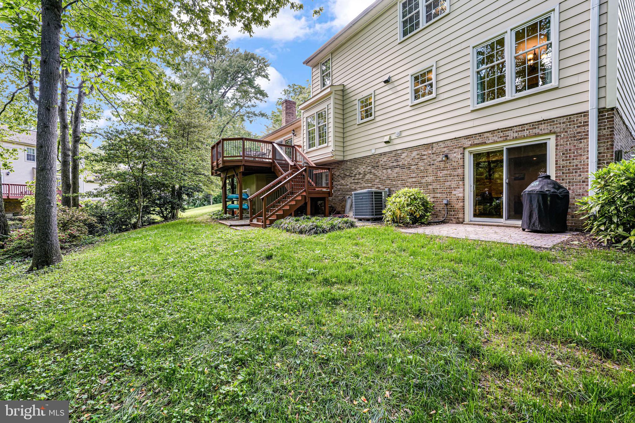 9802 Natick Road Burke, VA 22015 - Photo 40 of 45 a view of a house with backyard and sitting area
