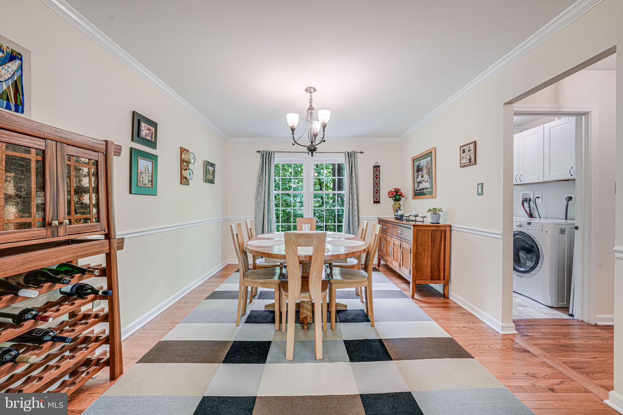 9802 Natick Road Burke, VA 22015 - Photo 8 of 45 a dining room with a rug and a window