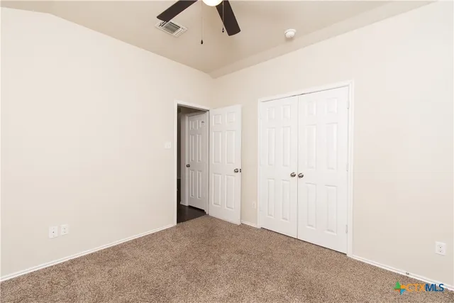 a view of a livingroom with a ceiling fan