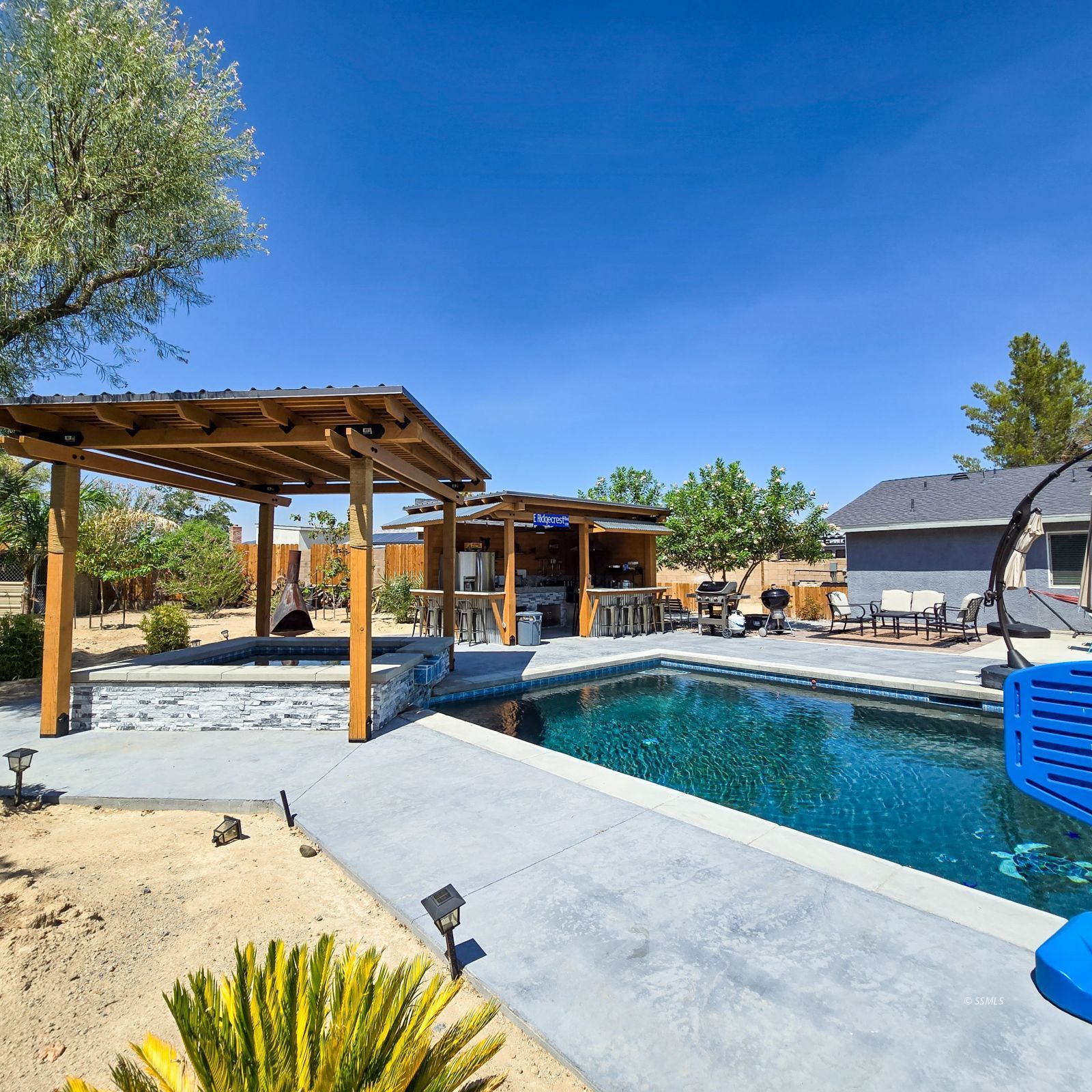 316 South Lilac Street Ridgecrest, CA 93555 - Photo 32 of 45 a view of a swimming pool with a patio