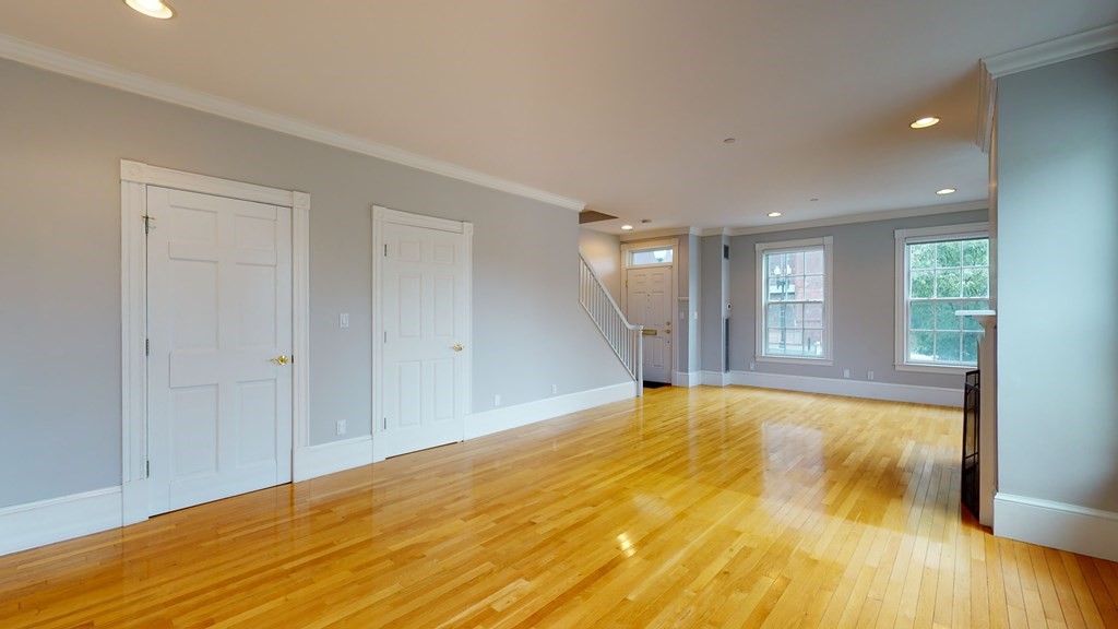 90 Constitution Road, Unit 90 Boston, MA 02129 - Photo 12 of 37 a view of empty room with wooden floor and fan