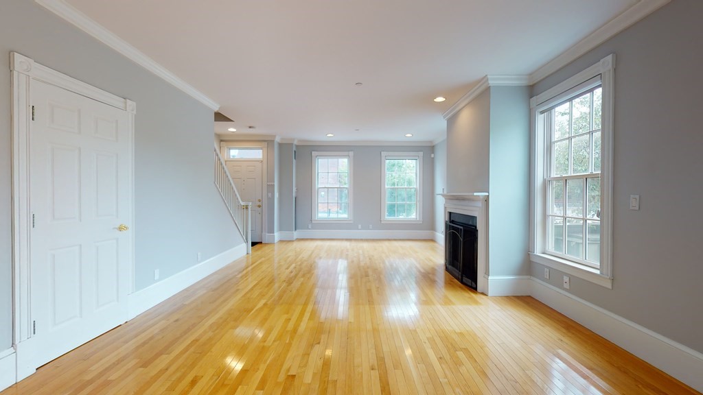 90 Constitution Road, Unit 90 Boston, MA 02129 - Photo 14 of 37 a view of an empty room with wooden floor and a window