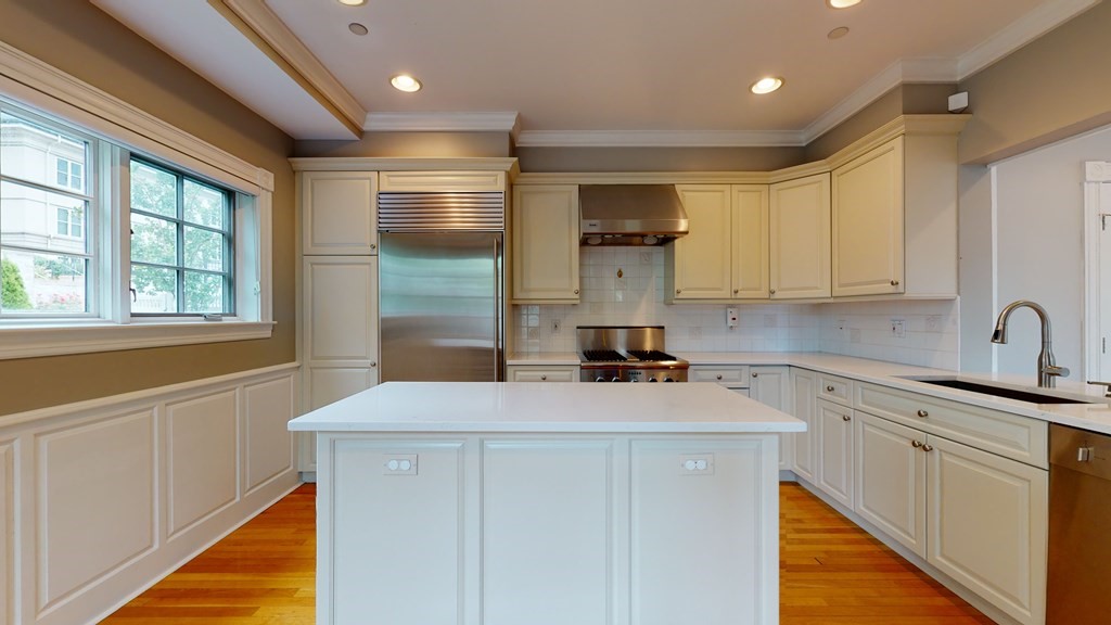 90 Constitution Road, Unit 90 Boston, MA 02129 - Photo 2 of 37 a kitchen with a sink stove and cabinets