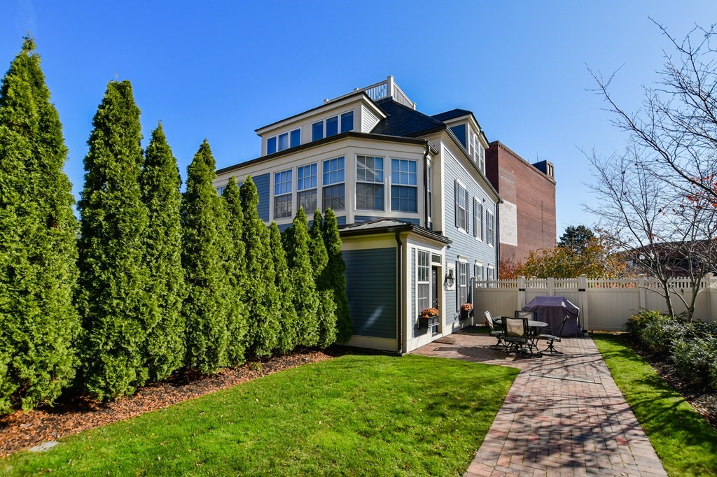 90 Constitution Road, Unit 90 Boston, MA 02129 - Photo 8 of 37 a front view of a house with garden