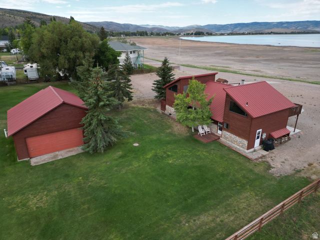 1825 North Cisco Road Laketown, UT 84038 - Photo 6 of 34 Red metal roof, wood siding, and stone accents