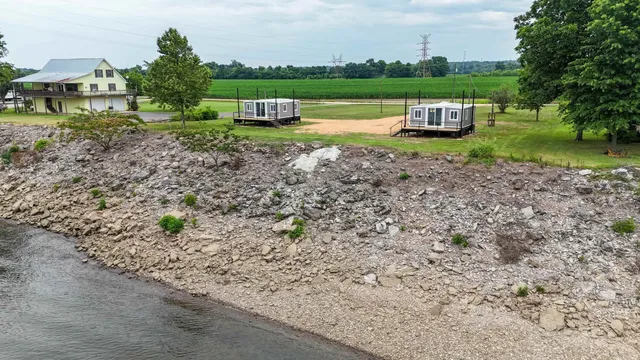 a house with a garden covered with wooden fence